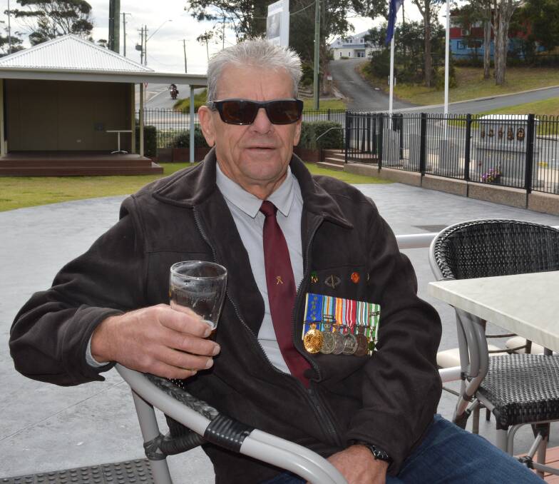 Narooma's Trevor Bennett recalls the Battle of Nui Le, 50 years on while he enjoys a beer with fellow Vietnam Veterans at the Narooma war memorial.