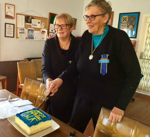 Celebrate: Narooma CWA August Birthday girls Marion Cullen and Margaret Doyle cutting CWA Narooma branch 89th birthday cake.