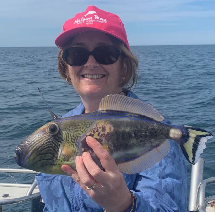 Narooma Sport and Gamefishing Club member, Michelle Baillie with a colourful six spined leatherjacket she caught while outside fishing on Thursday.