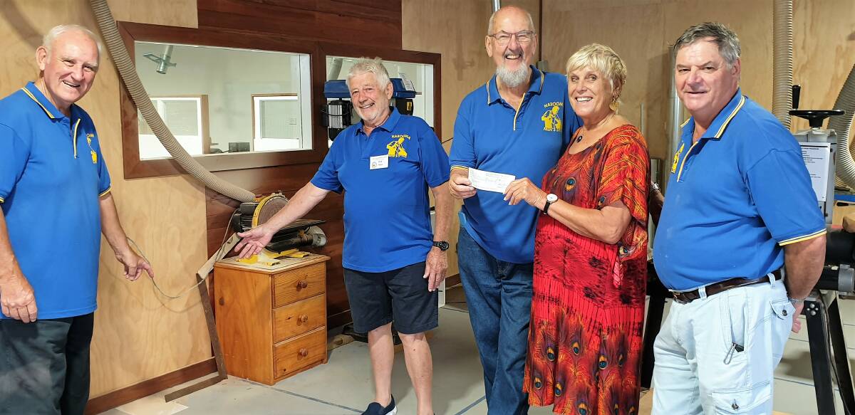 Watch that space: Narooma Men's Shed vice president Wal Sheehan, left, and Rick Hain show where the new sander will go, with president Bernie Perrett, Narooma Rotary president Ange and Wood Shed manager Dick Nagle looks on.
