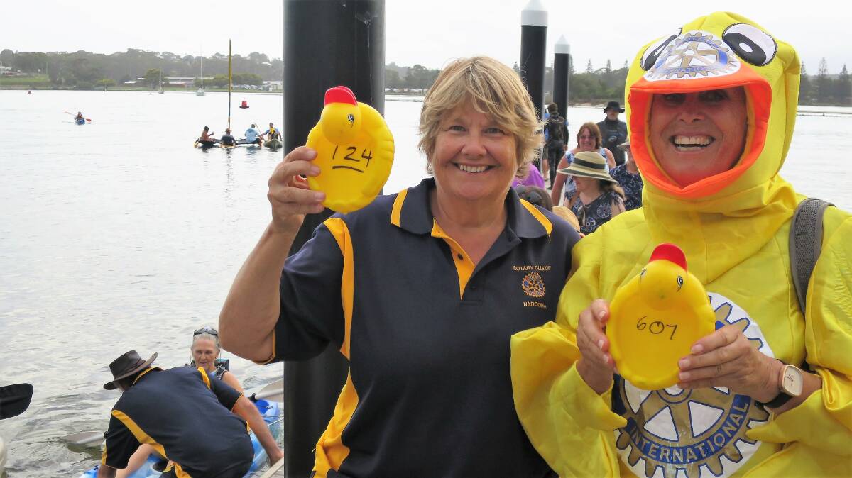 Narooma Rotary Australia Day Duck Race coordinator Charmaine White holds the winning duck 124, while Chief Duck Rotarian Ang Ulrichsen shows the last duck in the race 607.