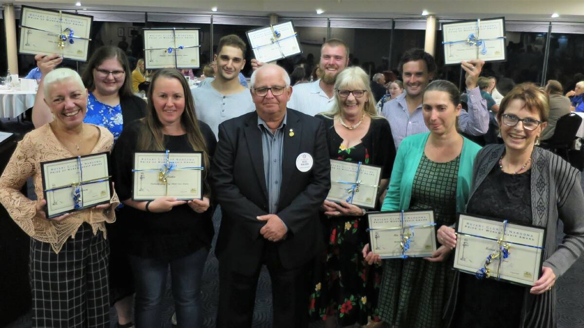 Narooma Rotary President Rod Walker, centre, presented Rotary Pride of Workmanship Awards on Thursday to Kimberley Clunne (IRT Dalmeny), front left, Jo Donkin (Dalmeny Long Day Child Care Centre), Jeannie Willoughby (Estia Health Dalmeny), Ria Manolias (Bodalla Dairy Shed), Karen Grindley (IRT Home Care); Melissa Burke (Tilba Real Dairy), back left, Ali Elmasri (Rapley's Mid-town Quality Meats), Scott Curry (Will's Water Worx). Will Farrell, back right, collected the award on behalf of Daniel Smith.