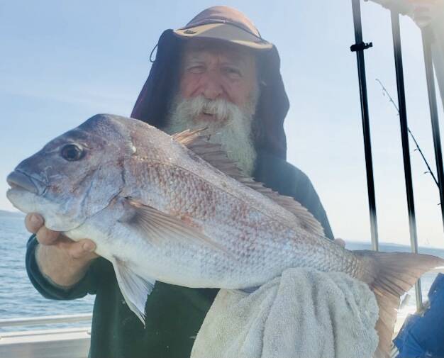 Narooma Sport and Gamefishing Club member John Moore with a great snapper caught off Tuross on Wednesday.
