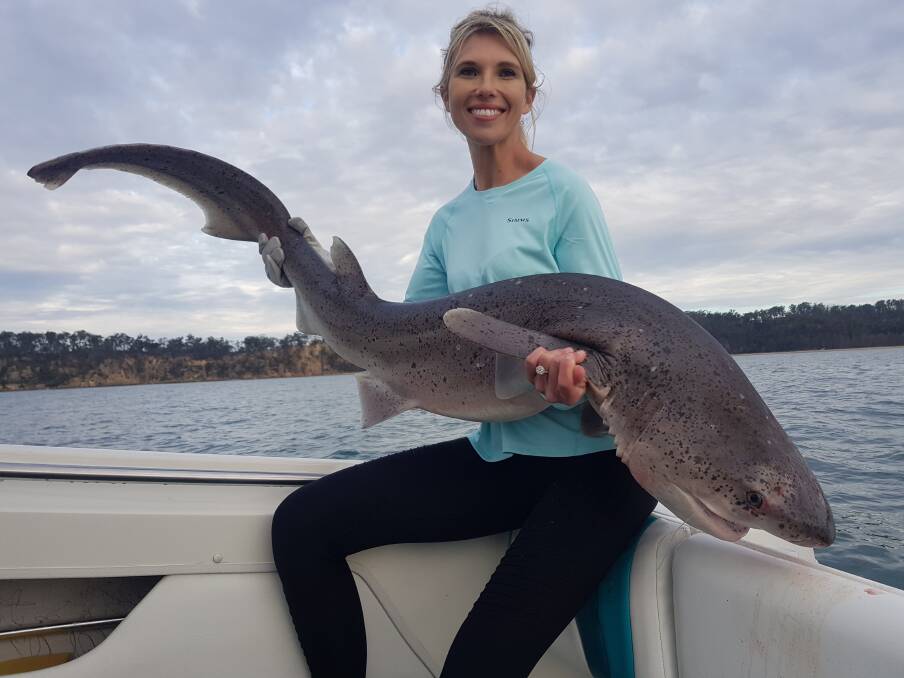 Emma Badullovich with a sevengill shark caught while fishing in 6 metres of water at Twofold Bay using 10kg tackle a fillet of Sergeant Baker.