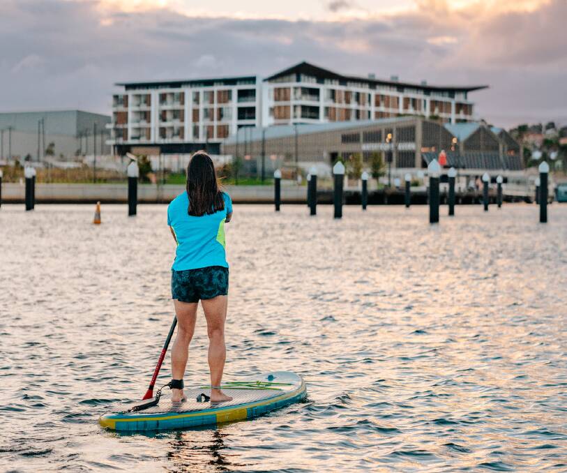 Paddleboarding is just one of the many activities enjoyed around Shellharbour. Picture supplied by Tourism Shellharbour.