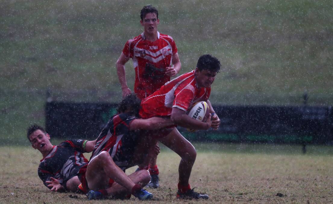Challenging conditions: Narooma prop Milo Campbell runs that ball during last week's opens final. Picture: Sylvia Liber. 