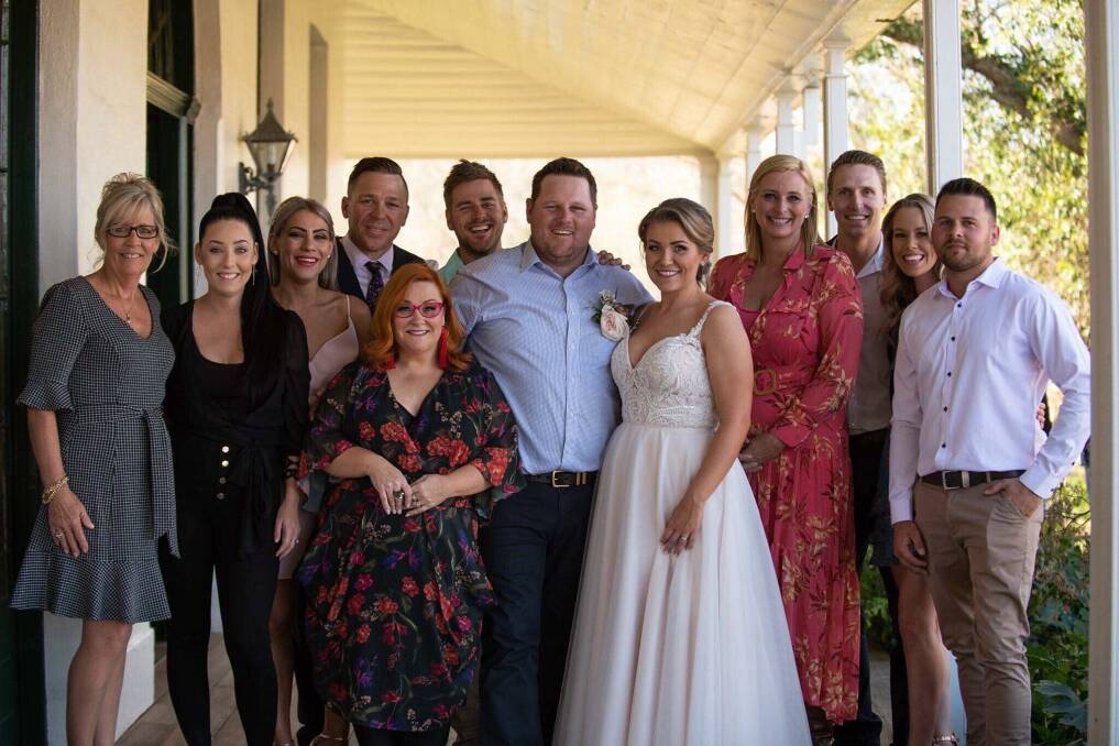 Mandy and Toad Heffernan on their wedding day with House Rules host Johanna Griggs and fellow contestants. Photo: Rachael M Photography