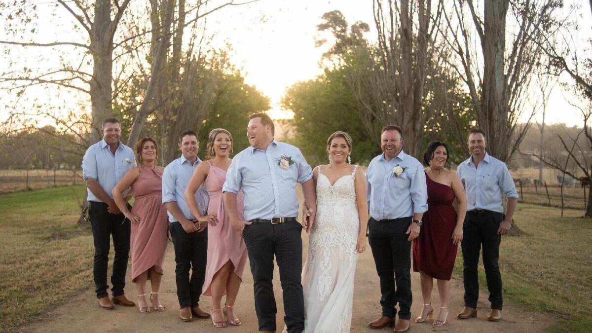 Mandy and Toad Heffernan with their wedding party which included Mandy's three sisters, including her twin sister. Photo: Rachael M Photography