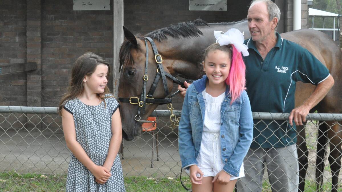 RACE DAY FUN: Jesse Doull, 9, Ava Hughes, 9, and Michael Robinson ahead of the first race of the Narooma Cup Day.