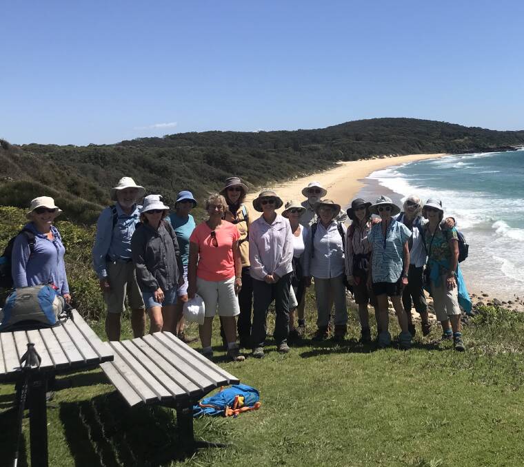 Perfect day: Members of Dalmeny Narooma Bushwalkers, plus a couple of extras, pose for a photo near the Dreaming Track.
