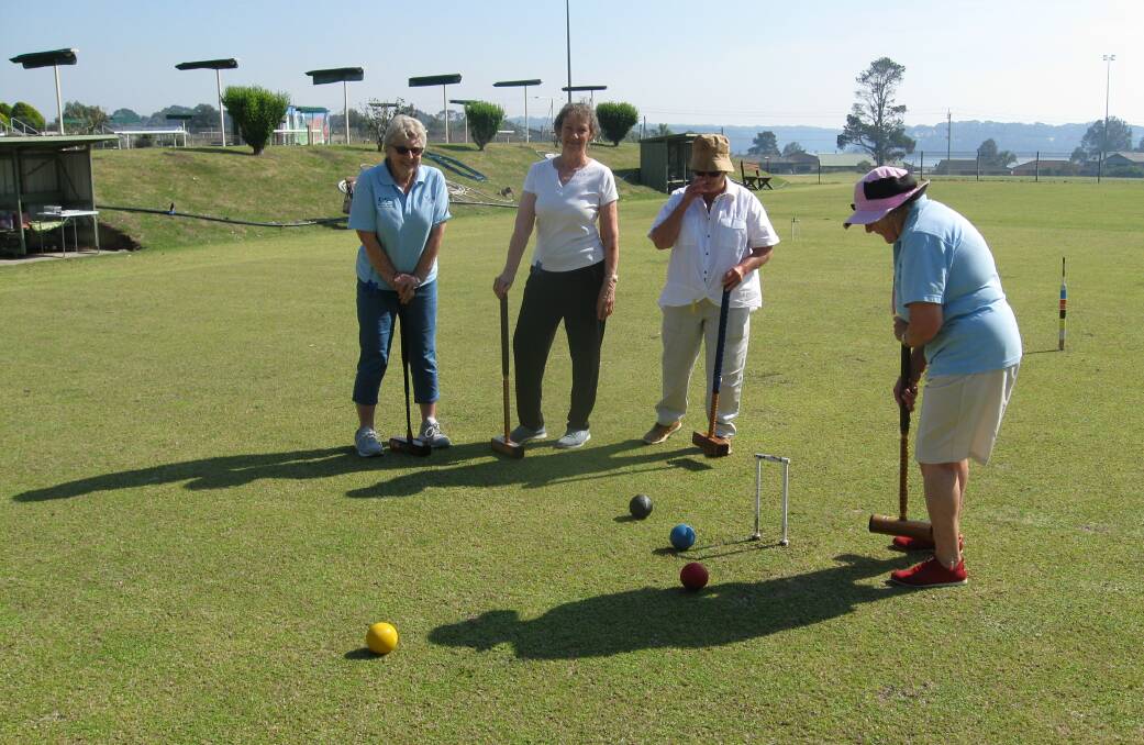 Play suspended: Happy players in happier times at the Narooma Croquet Club.