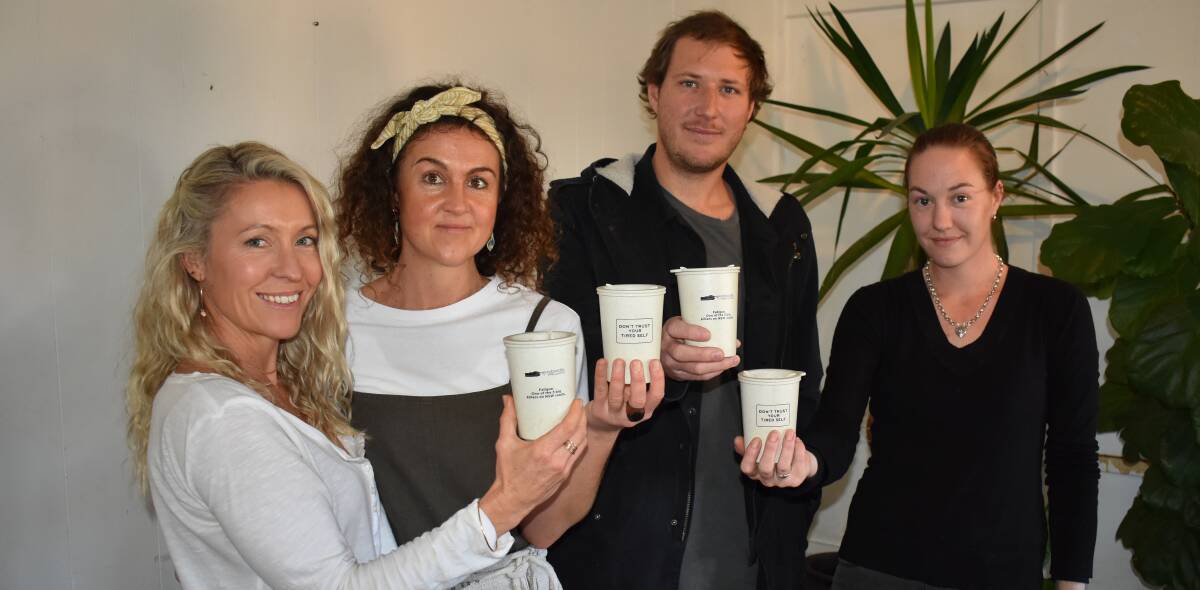 Cups half full: Charms Baltis of Half Moon Yoga, Corey Mood of Bound to Earth, Bill Adams of Surfbeach Cafe and Jessica Glew from Caseys Cafe see a promising future for "borrow cups".