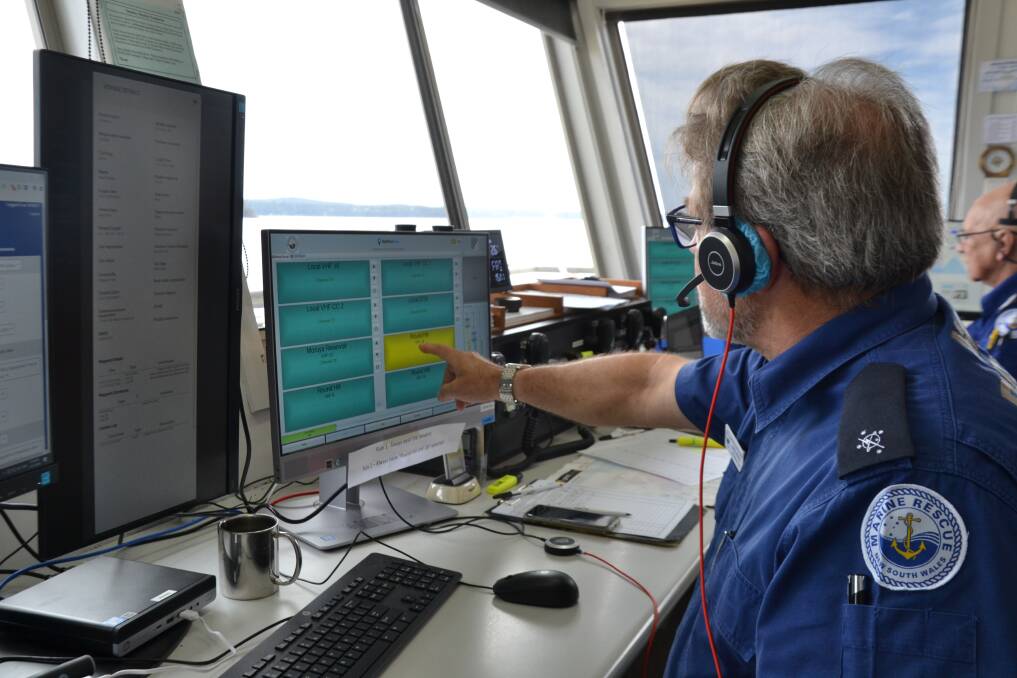 Batemans Bay Marine Rescue radio operators Greg Irvine and Peter Vark with updated radio equipment including new touch screens at their Hanging Rock headquarters.