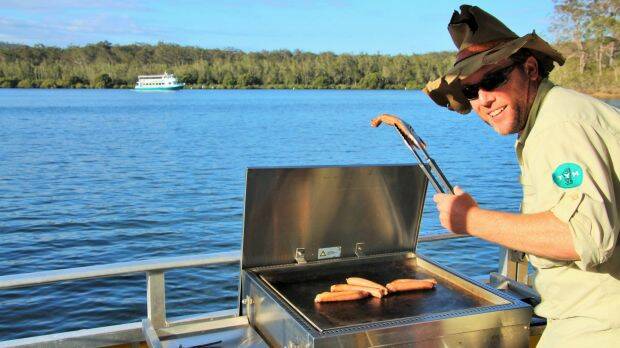 Paradise is cooking snags on the custom-made BBQ boat. Photo: Dave Moore

