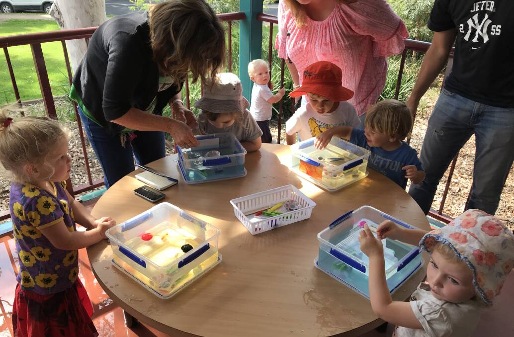 Children and parents who attended Moruya Library’s storytime on Wednesday made predictions on whether different items would sink or float, as well as listening to stories and doing craft.