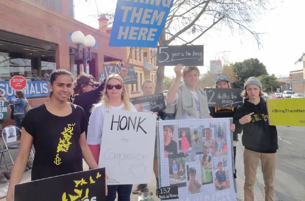 Members of the Refugee Action Collective Eurobodalla at a protest in Nowra earlier this year.