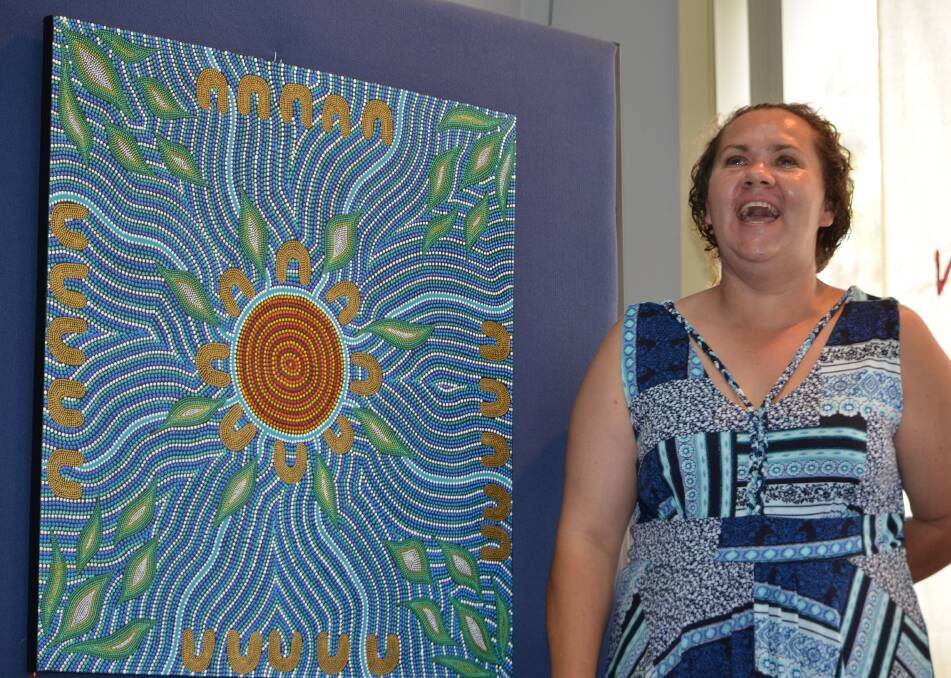 SOUTH COAST TALENT: Sherrie Nye, with one of her artworks at the Wangganga Aboriginal Art Exhibition in Mogo on Saturday.