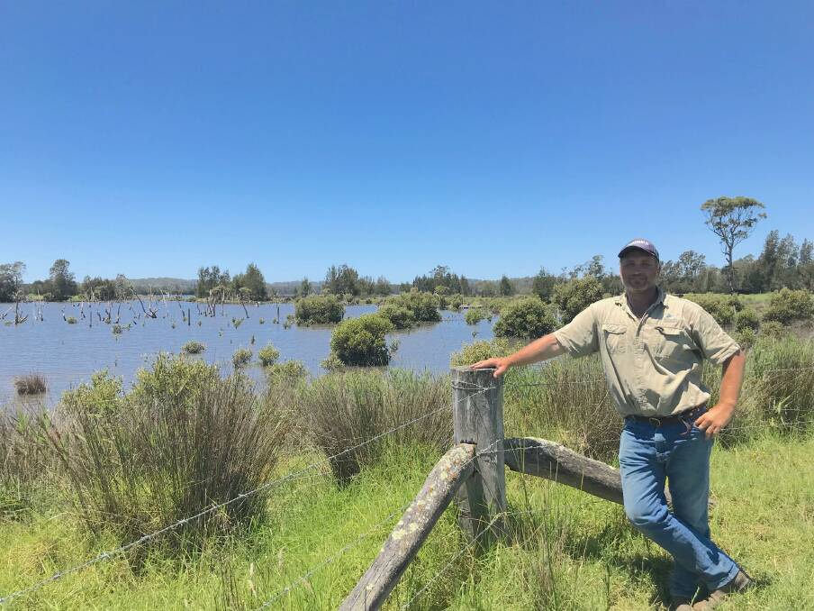 NEW OWNER: Andrew Hart on his wetland property at Coopers Island, Bodalla. He has been erecting fencing to prevent stock from entering the river and fringing wetlands and causing more silt to enter the water.
