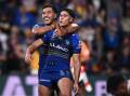 Blaize Talagi, grabbed by Will Penisini after scoring against the Broncos, may be a man in demand. (Dan Himbrechts/AAP PHOTOS)