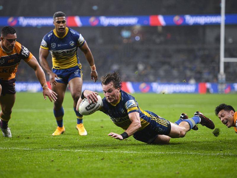 Clint Gutherson scores one of two tries for the Eels in their 26-12 NRL win over the Broncos.