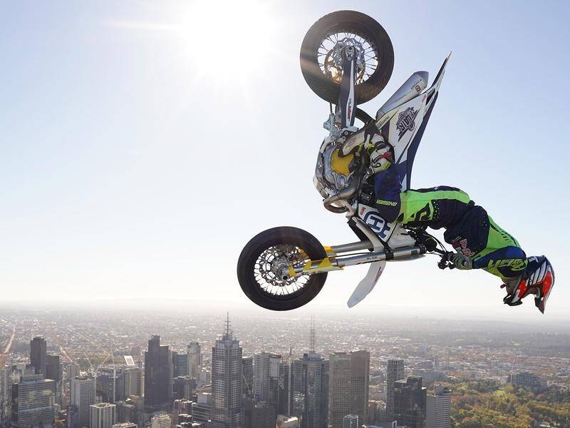 Daredevil rider Jack Field performed a motorcycle backflip on the roof of Melbourne's Eureka Tower.