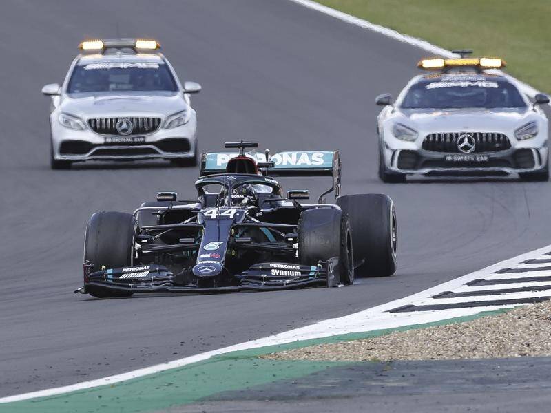 Lewis Hamilton won the British Grand Prix on three wheels at Silverstone after a last-lap puncture.