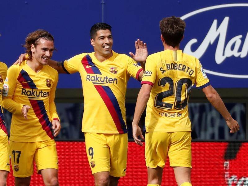 Barcelona's front three have all scored in a 3-0 victory over Eibar in Spain's La Liga.
