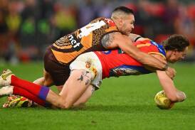 The AFL, after some coaching backlash, has made a call to change the holding the ball rule. (Morgan Hancock/AAP PHOTOS)
