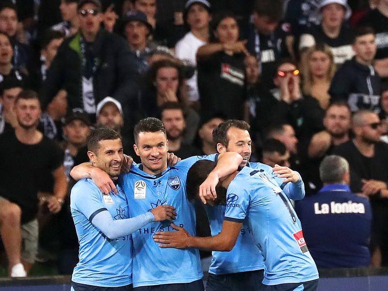 Competition leaders Sydney FC have beaten Melbourne Victory 3-0 in their A-League "Big Blue".