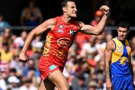 Gold Coast's Jarrod Witts shows his delight after scoring a goal against the Eagles. (Dave Hunt/AAP PHOTOS)