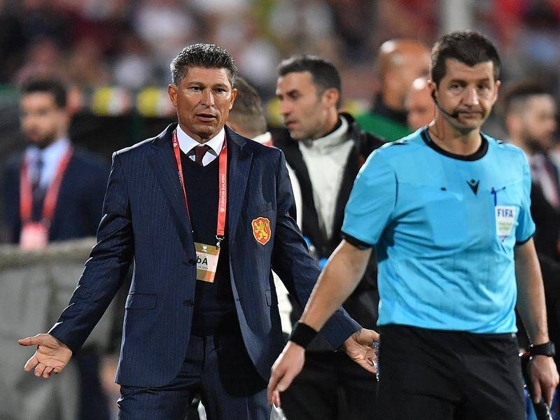 Bulgaria coach Krasimir Balakov (L) has resigned after a 6-0 defeat to England was marred by racism.