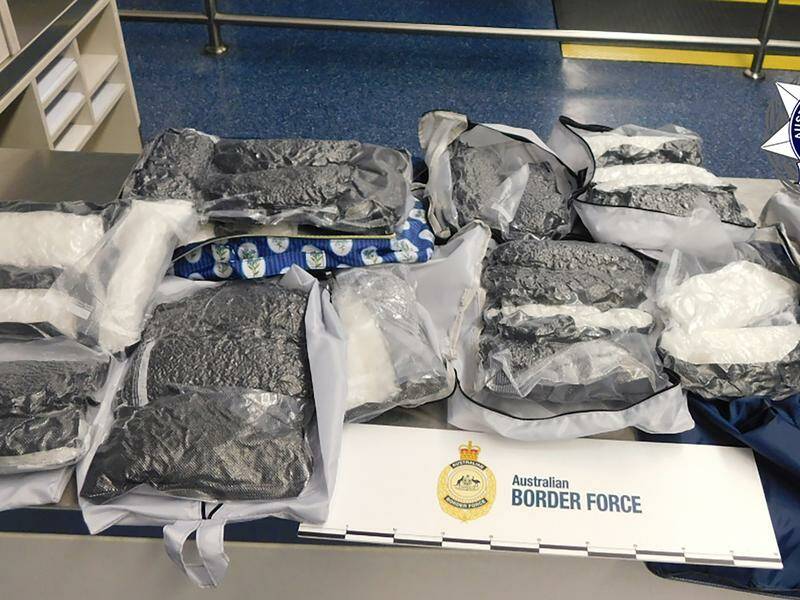 A woman asked airport staff to help find her suitcase, which AFP officers say was packed with drugs. Photo: HANDOUT/AUSTRALIAN FEDERAL POLICE A woman asked airport staff to help find her suitcase, which AFP officers say was packed with drugs. Photo: HANDOUT/AUSTRALIAN FEDERAL POLICE