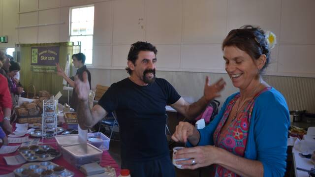 
FUN TIMES: Rob O’Brien of Narooma has a bit of fun with Sue Andrew at the local produce display in the Big Hall at the Tilba Festival.
