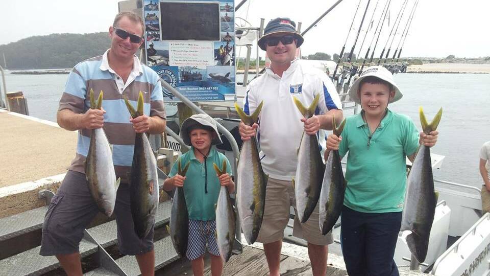 GOOD DAY: Nathan and Archie Stoll, Ben and Fergus Howard from Wagga managed 10 legal kingfish (between 6 and 7kg) on the Playsation on Thursday at Montague Island where the water colour and temp had improved - mostly taken on jigs. 