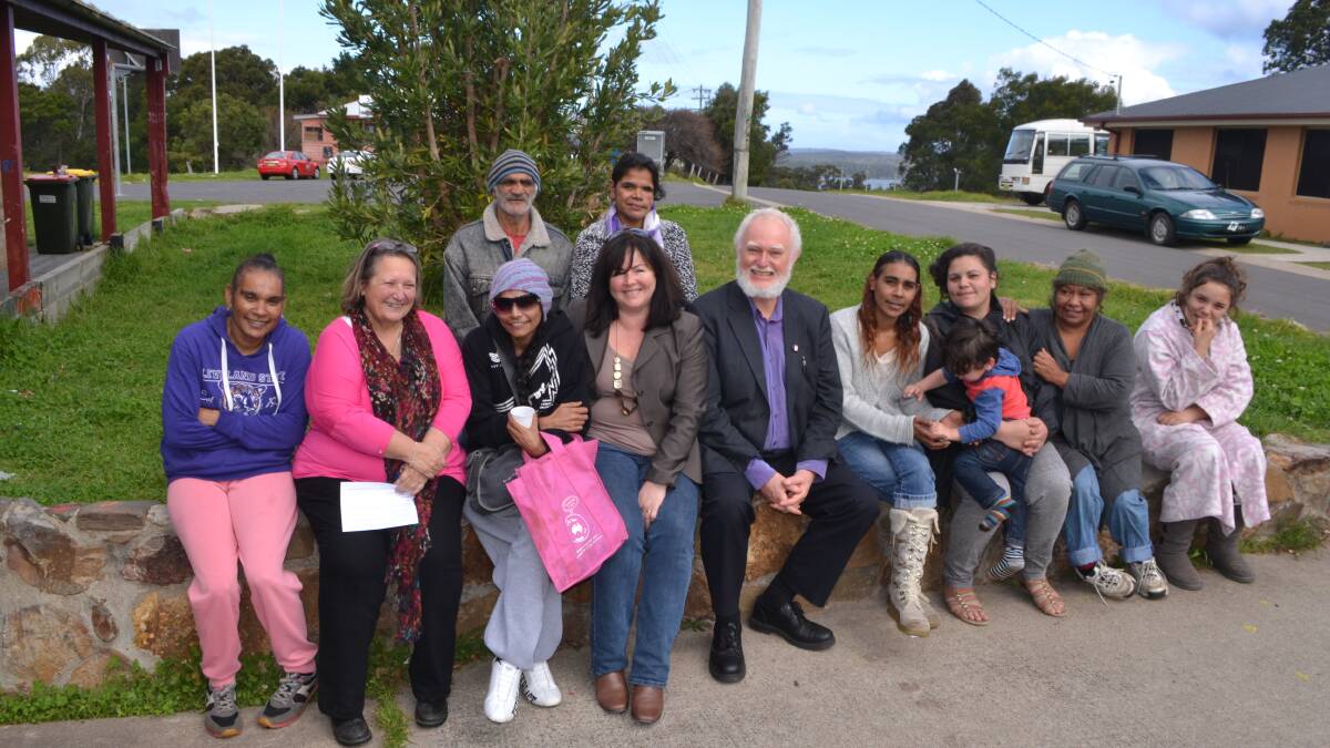 RETIREMENT PARTY: Sean Burke, pictured centre, at his farewell party at Wallaga Lake Koori village community centre, with some of the locals as well as Merrimans Land Council CEO Anne Greenaway and Eurobodalla Shire Council economic development officer Sarah Cooper. 