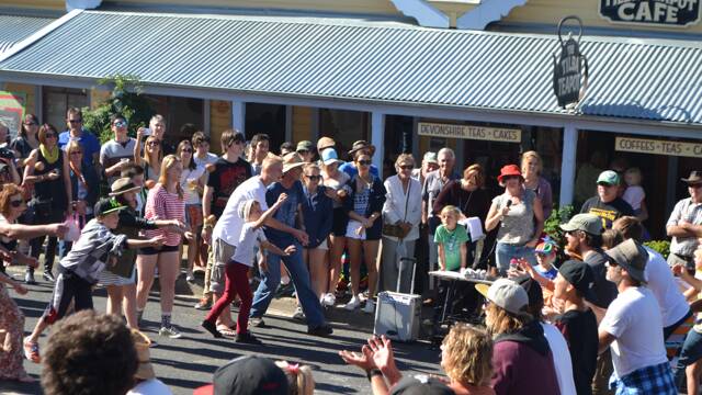 EGG TOSSERS: The egg toss is always a big hit at the Tilba Festival with catchers and throwers doing their best on Bate Street.