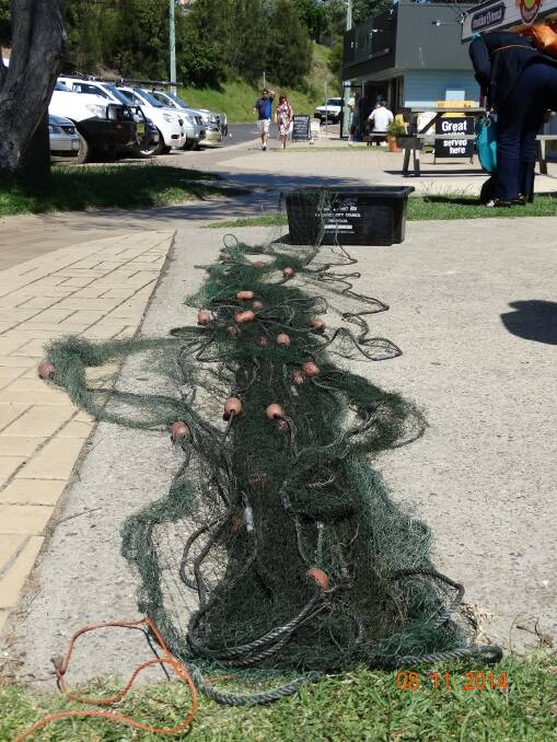 ILLEGAL NET: The confiscated net laid out in front of the Narooma Fisheries office after a Kianga man was caught on Mummaga Lake, Dalmeny. 