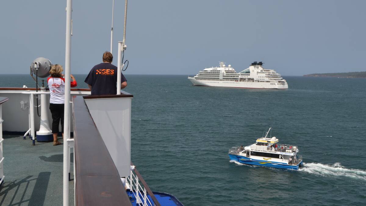 LOCAL TOURS: The Eden tour baat Cat Balou cruises between the two cruise ships with the MV Seabourn Sojourn in the backgound.