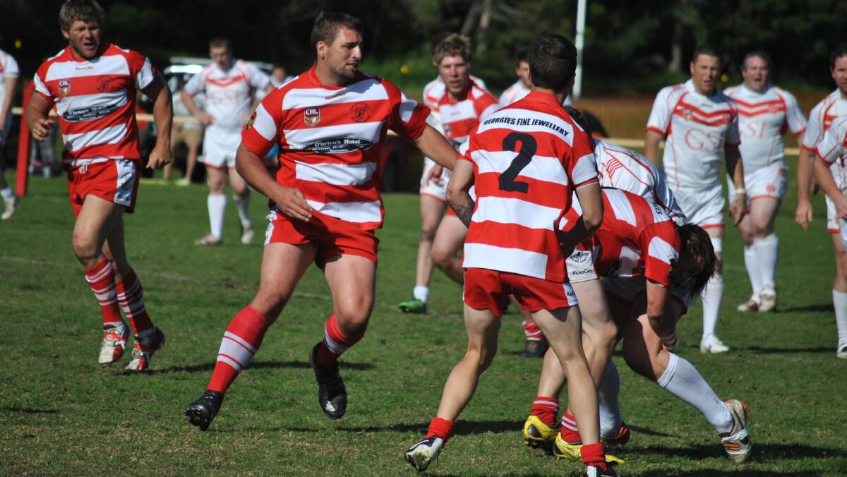 DEVILS TRIUMP: Narooma Devils from left Todd Ayres, Tony Tyrrell, Justin Keegan, number 2 Tom Cooney and Tyler Hextell tackling during their game where they defeated the Eden Tigers 40 to 16 at Bill Smyth Oval on Sunday. 