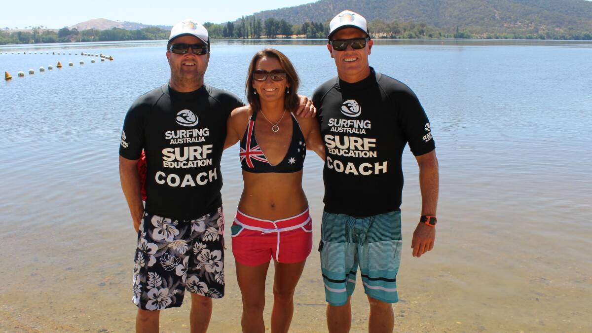 SURF STAR: South Coast Standup Paddleboarding coaches Dean Loudoun and Andrew “Macca” McCaughtrie with seven-time world champion Layne Beachley. 