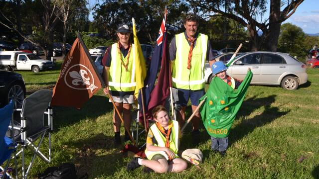 
GOOD JOB: The Cobargo Scouts and Cubs did a great job on parking duties at the Tilba Festival on Easter Saturday, a carefully choreographed exercise given the boggy ground. Akela Andrew Burden pictured with India Burden, Jamie and Sam Hackett.
