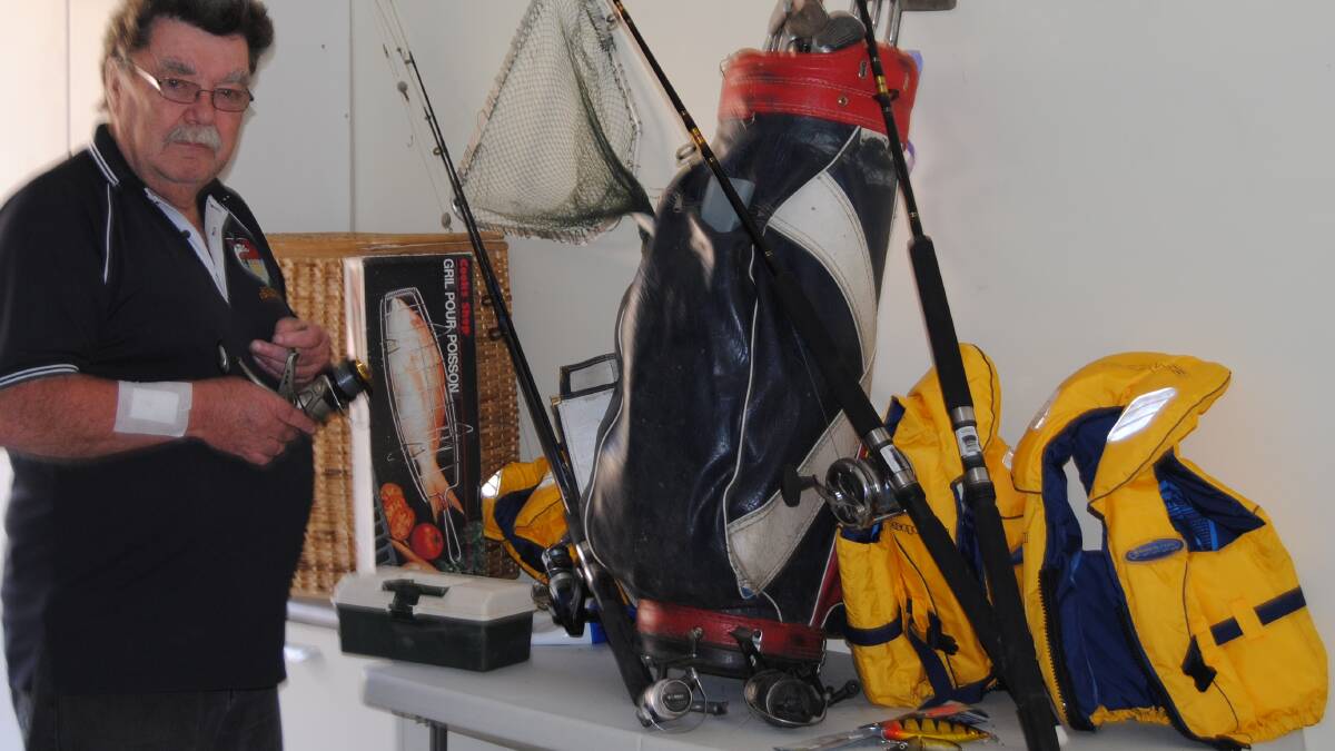 FISHING MARKET: Terry Vincent with some of the gear that will be for sale this Saturday at the fishing club’s market day, where rods, reels, lures, and other fishing equipment will be for sale at bargain prices. 