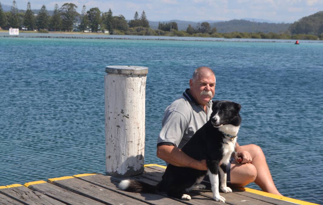 BRAVERY RECIPENT: Retired police officer and dog handler Rod Howard of Narooma has been recognised with a Bravery Medal. He is pictured with his new dog, Kurt, who he adopted after it failed tests to become a prison dog. 