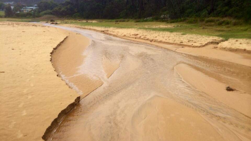 BRAIDED CHANNEL: After reports of as much as 120mm overnight at Central Tilba, all the storm water had formed a braided channel at Mystery Bay on Wednesday morning. Photo by editor Stan Gorton 