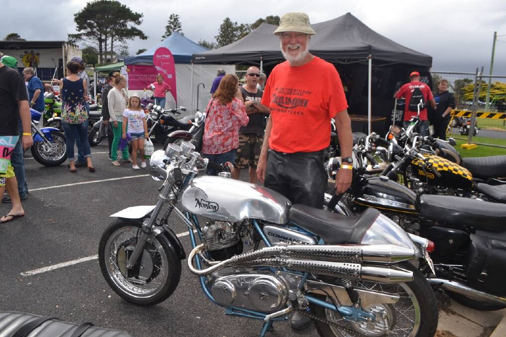 TRIUMPH MANN: Mal Mann of Tomakin is a Triumph man but was caught
admiring this shiny Norton at the CRABs Bermagui Bike Show 2014.
 
