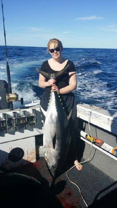 BIRTHDAY FISH: Cody Bond and his girlfriend Lucy went tuna chasing on his 21st birthday on Tuesday and here is Lucy with a bluefin tuna.  