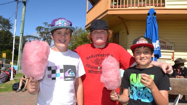 
SCHOOL MATES: Enjoying the fairy floss from Bates Store are Joel Sweeney, Albie Betteridge and Kurt Zideluns at the Tilba Festival on Easter Saturday.
