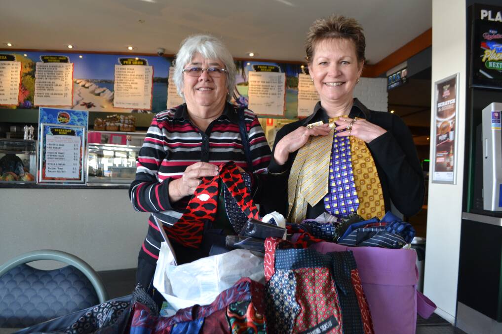 TIES GALORE: Pam Muller from the Riverland stopped in at O’Briens Hotel to pick up 250 ties donated by the people of Narooma thanks to the efforts of Karen Baker. 