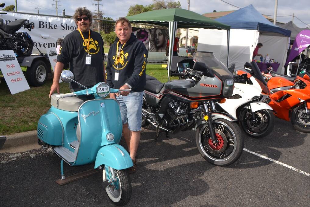 LOCAL VESPA: CRABs member Dave Monk and Wayne Brooks with the 1961 Vespa Super 150 owned by Alberto from the Bermagui Gelato. Wayne restored from a wreck with local painter John Malino doing a great job.  