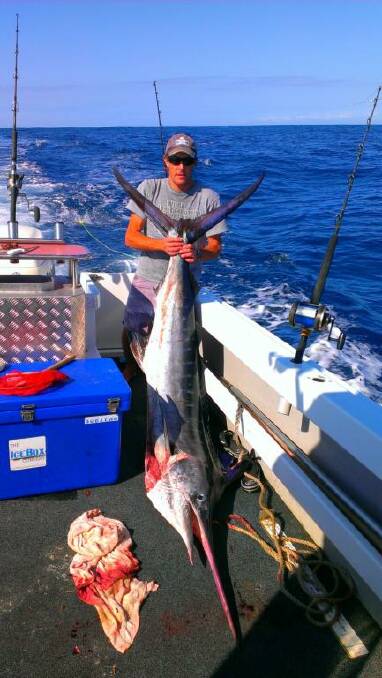 BUTCHER’S MARLIN: Local Narooma butcher Dave White with his striped marlin – well done to Whitey. 
